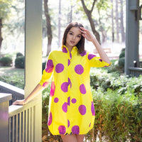 Woman wearing Anaario Katy Perry Bubble Hem Dress, yellow dress with purple polka dot print and bubble hem