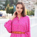 Woman wearing Anaario La Belle Tunic, pink floral print tunic with yellow flower patch and belted waist