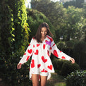 Woman wearing Anaario Love Island Shirt, white oversized shirt with red heart print