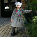 Girl wearing Anaario Meadow Mist Pea Coat, grey plaid coat with heart appliques and tie waist