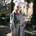 Girl wearing Anaario Meadow Mist Pea Coat, grey plaid coat with heart appliques and tie waist