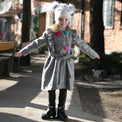 Girl wearing Anaario Meadow Mist Pea Coat, grey plaid coat with heart appliques and tie waist