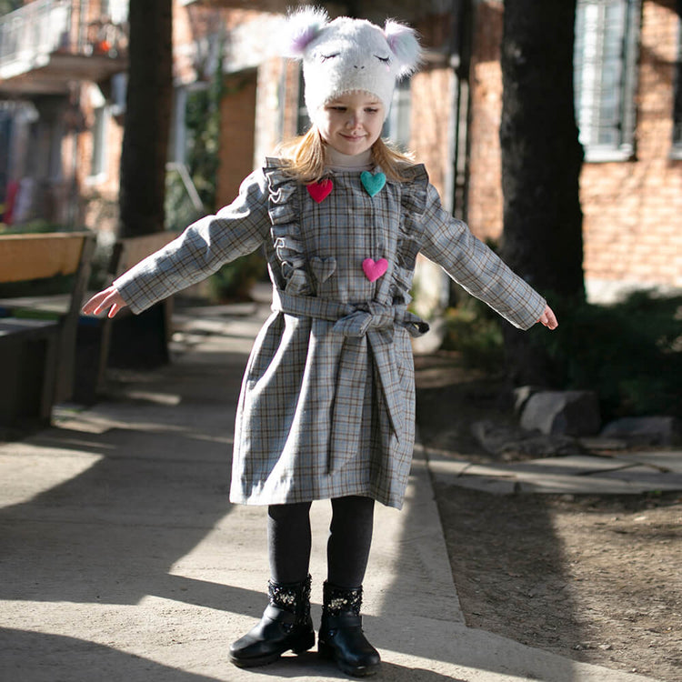 Girl wearing Anaario Meadow Mist Pea Coat, grey plaid coat with heart appliques and tie waist