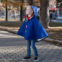 Girl wearing Anaario Mulan Cape Coat, royal blue hooded cape coat with heart button closures