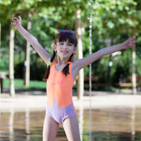 Girl wearing Anaario Orange Purple Star One Piece swimsuit, orange and lilac colorblock one-piece swimsuit with star-point seam design