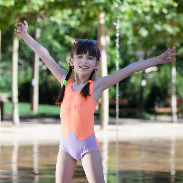 Girl wearing Anaario Orange Purple Star One Piece swimsuit, orange and lilac colorblock one-piece swimsuit with star-point seam design
