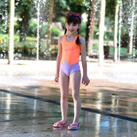 Girl wearing Anaario Orange Purple Star One Piece swimsuit, orange and lilac colorblock one-piece swimsuit with star-point seam design