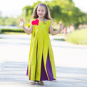 Girl wearing Anaario Pixie Dixie colorblock maxi dress in lime green, purple, and orange