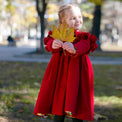 Girl wearing Anaario Red Riding Hood Dress, red ruffle-shoulder coat dress