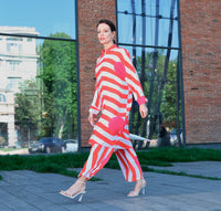 Woman wearing Anaario Sweet Serenade Co-ord Set, red and white striped shirt and matching pants