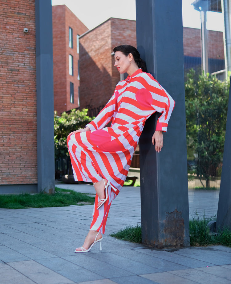Woman wearing Anaario Sweet Serenade Co-ord Set, red and white striped shirt and matching pants