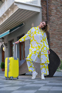 Person wearing Anaario Sweet Serenade Co-ord Set, yellow and white abstract print longline shirt with matching pants