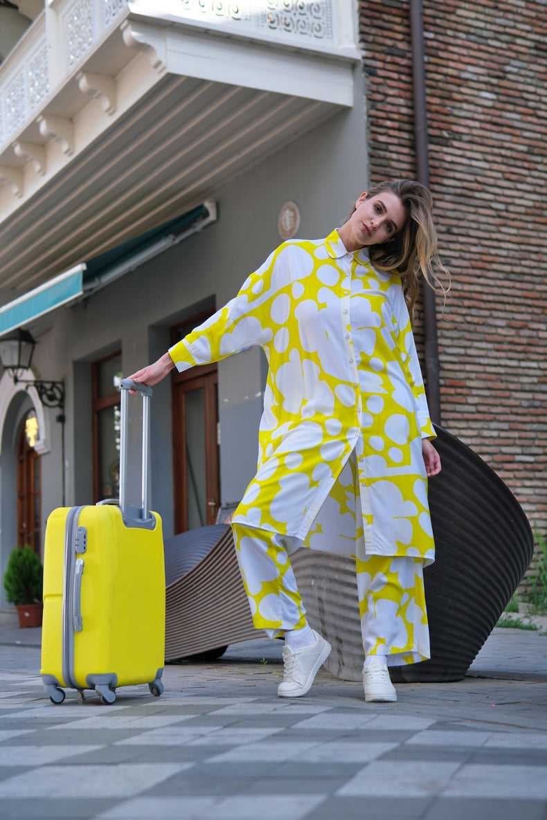 Person wearing Anaario Sweet Serenade Co-ord Set, yellow and white abstract print longline shirt with matching pants