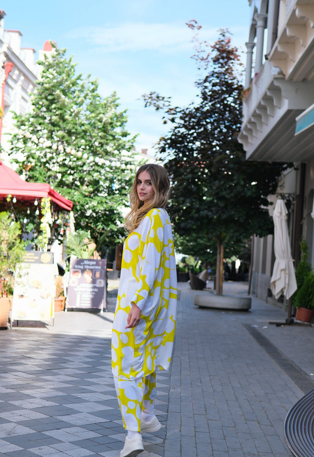 Person wearing Anaario Sweet Serenade Co-ord Set, yellow and white abstract print longline shirt with matching pants