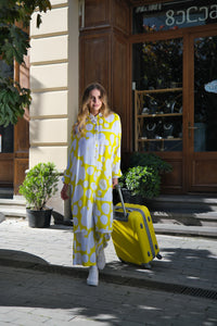 Person wearing Anaario Sweet Serenade Co-ord Set, yellow and white abstract print longline shirt with matching pants