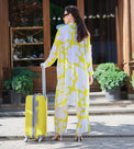 Person wearing Anaario Sweet Serenade Co-ord Set, yellow and white abstract print longline shirt with matching pants