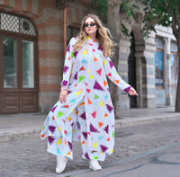 Person wearing Anaario Wild Wanderer Co-ord Set, white maxi duster with multicolor triangle print over matching pants
