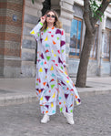Person wearing Anaario Wild Wanderer Co-ord Set, white maxi duster with multicolor triangle print over matching pants