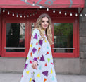 Person wearing Anaario Wild Wanderer Co-ord Set, white maxi duster with multicolor triangle print over matching pants
