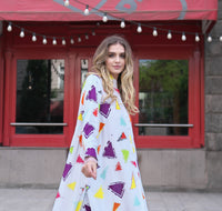 Person wearing Anaario Wild Wanderer Co-ord Set, white maxi duster with multicolor triangle print over matching pants