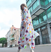 Person wearing Anaario Wild Wanderer Co-ord Set, white maxi duster with multicolor triangle print over matching pants