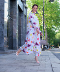 Person wearing Anaario Wild Wanderer Co-ord Set, white maxi duster with multicolor triangle print over matching pants