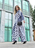 Person wearing Anaario Wild Wanderer Co-ord Set, navy and white mixed polka dot maxi duster with matching pants