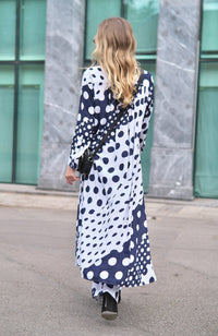 Person wearing Anaario Wild Wanderer Co-ord Set, navy and white mixed polka dot maxi duster with matching pants