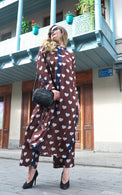 Person wearing Anaario Wild Wanderer Co-ord Set, brown maxi duster with white heart print over matching pants