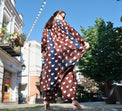 Person wearing Anaario Wild Wanderer Co-ord Set, brown maxi duster with white heart print over matching pants
